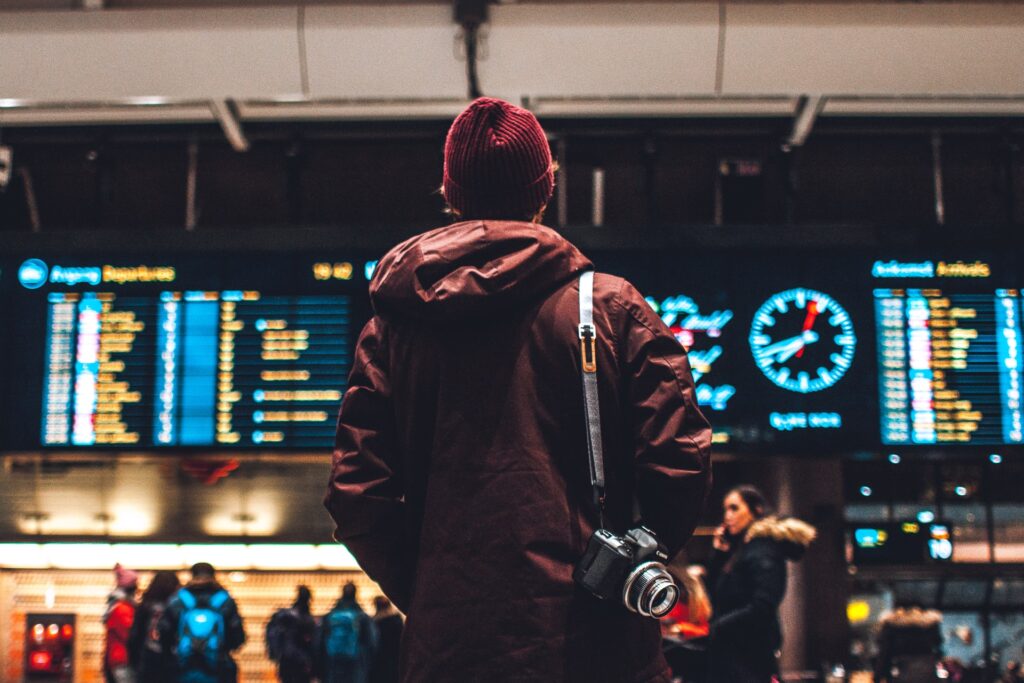 A person looking at the flight schedule