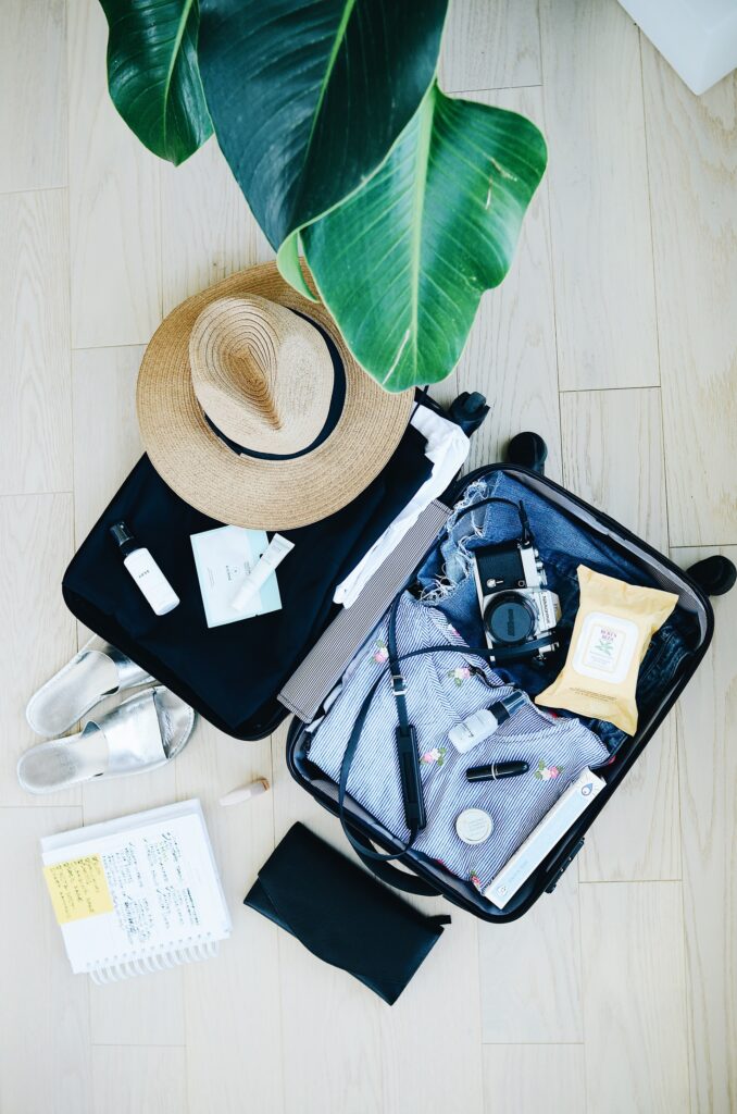 A travel case filled with accessories and clothes